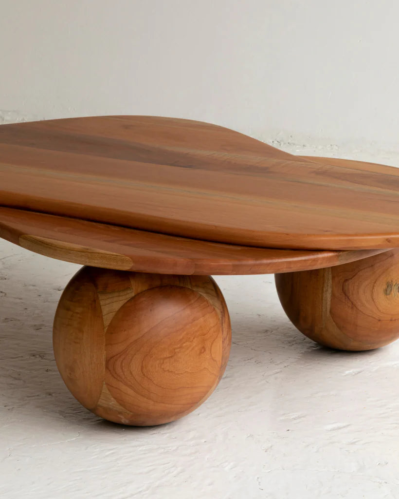 Wooden table with a unique design on a light background