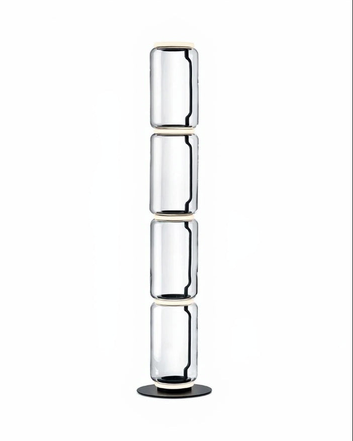 Clear glass vase with three cylindrical sections on a white background