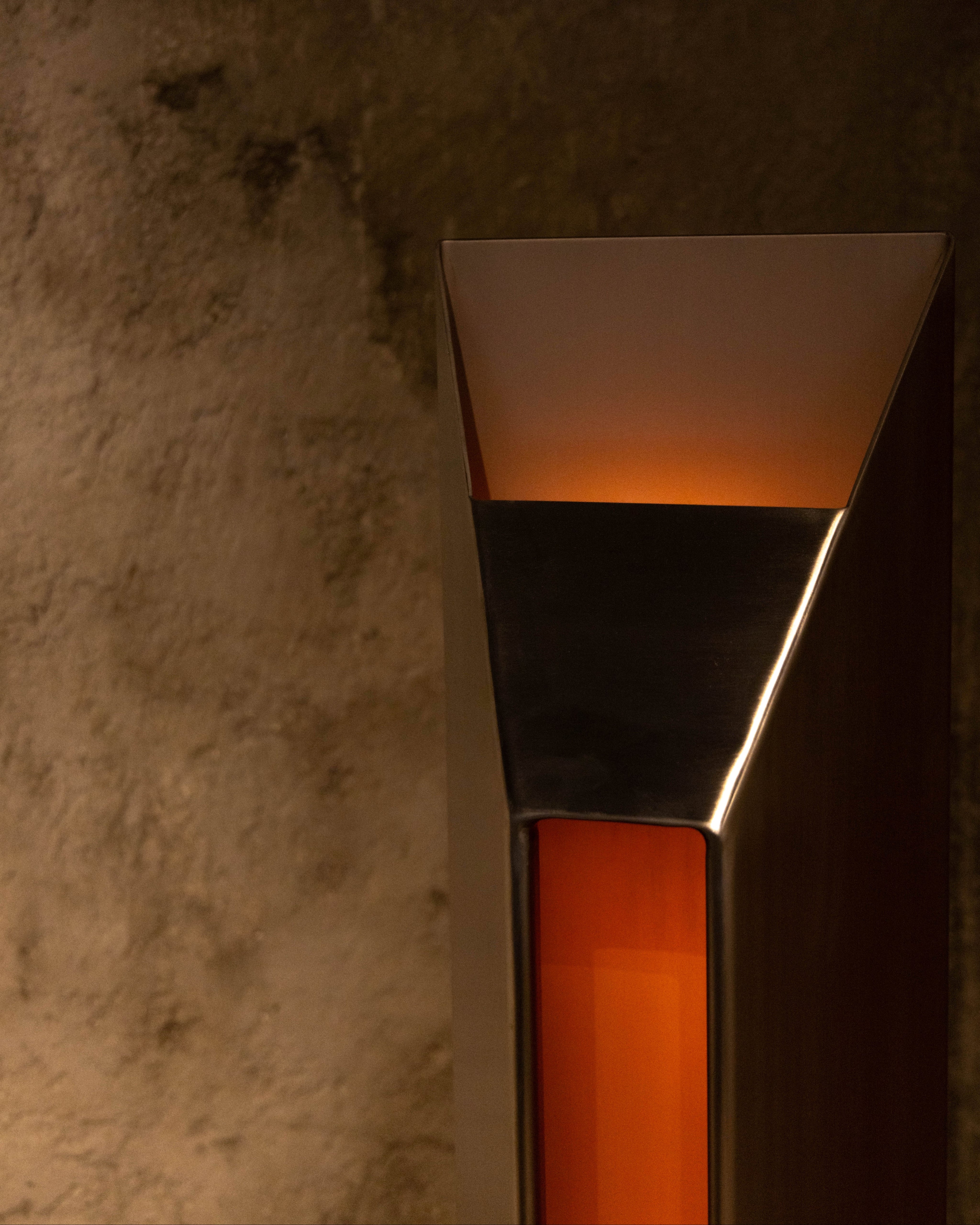Wall-mounted light fixture with warm glow 