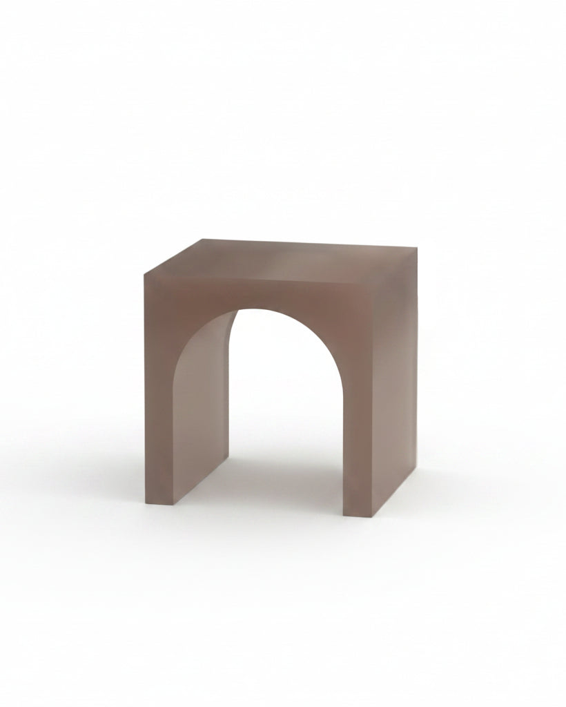 Minimalist brown side table with arch design on a plain background
